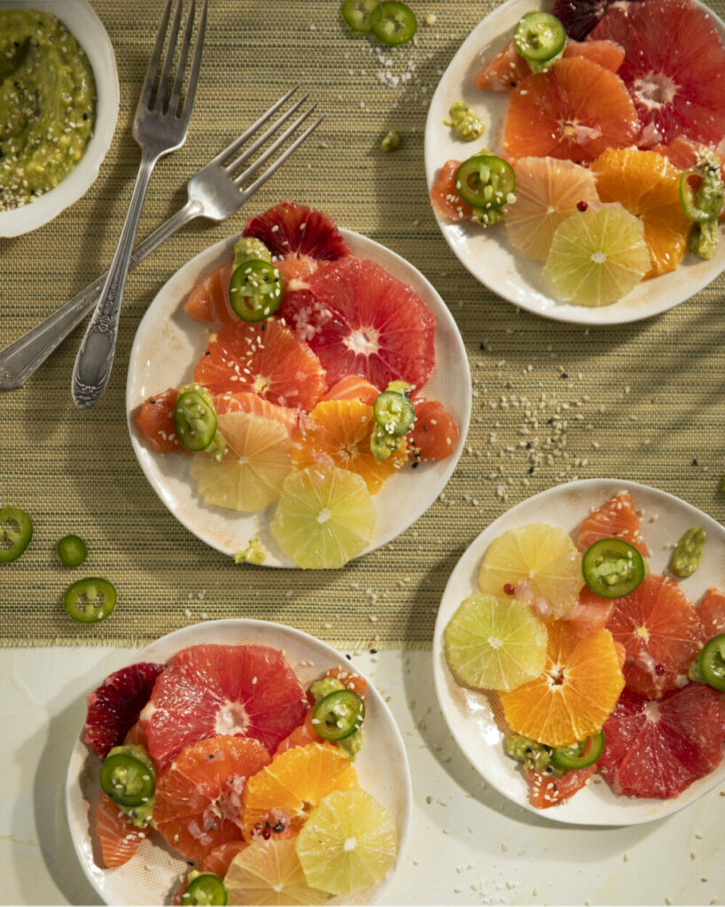 A Citrus Salmon Carpaccio recipe plated in bright colors.