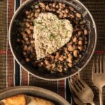 Black Eyed Peas and Rice served in a bowl with three forks on the side