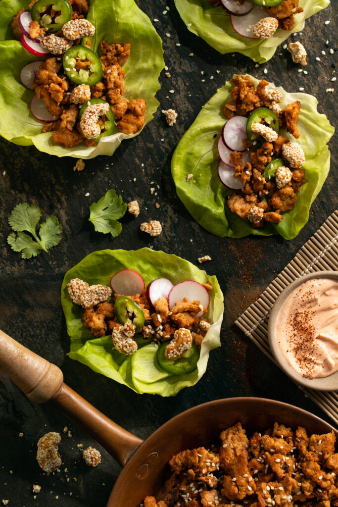 A flat-lay view of chicken bulgogi lettuce wraps illustrating a chicken lettuce wraps recipe.