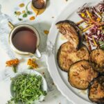 A mouthwatering plate of sweet fried eggplants, a delicious dish traditionally enjoyed during Hannukah celebrations.