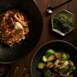 A wholesome and farro risotto made with earthy mushrooms, and indulgent Taleggio cheese, creating a delicious and satisfying dish with a rustic and comforting appeal.