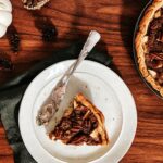 A slice of Dutch Apple Pie sits on a white plate. Dutch Apple Pie recipe