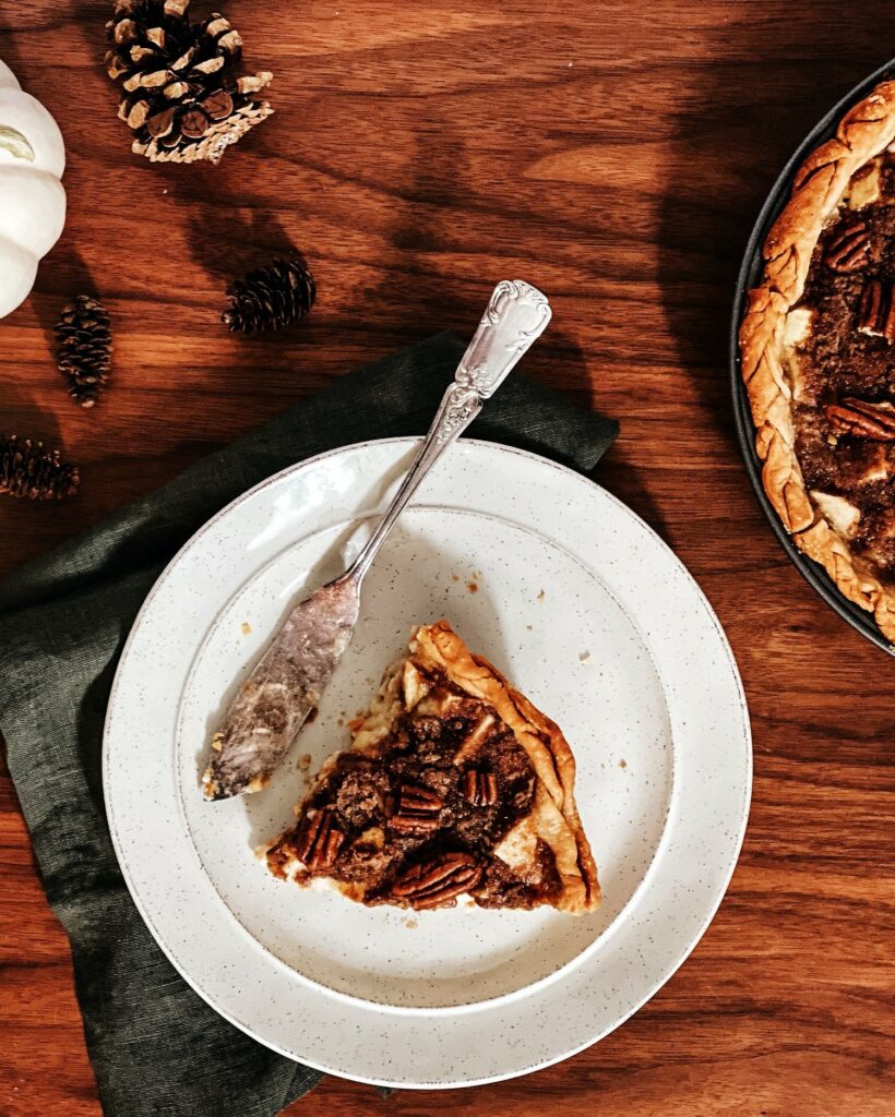 A slice of Dutch Apple Pie sits on a white plate. Dutch Apple Pie recipe