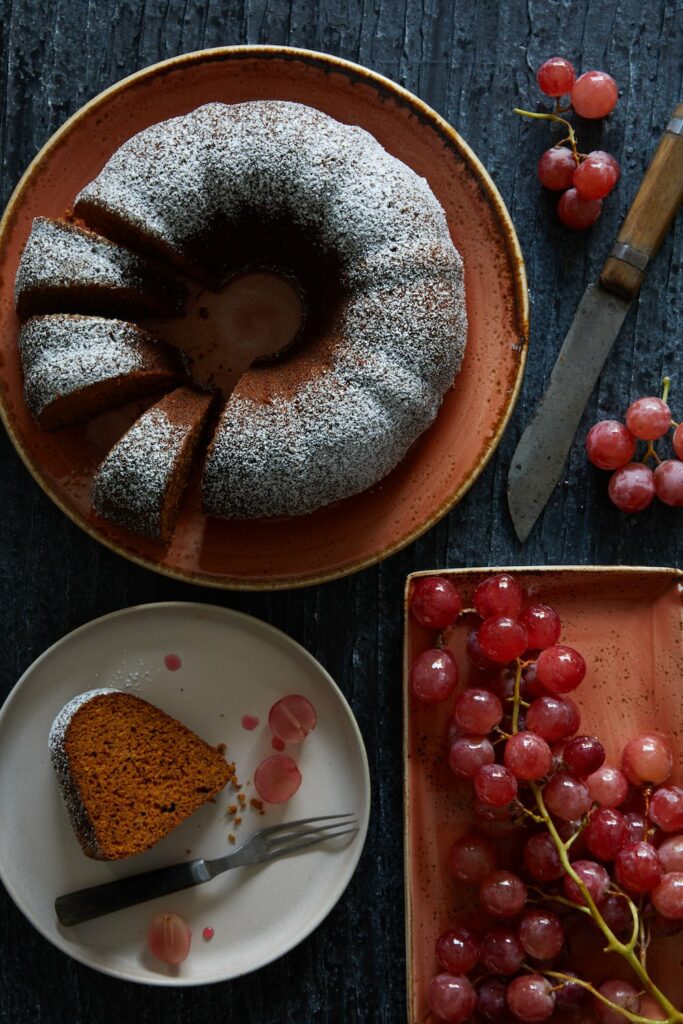 An aerial view of a Carrot Cardamom Bundt Cake with a few pieces cut out