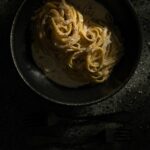 A black dish filled with Fettucine Aldredo made by Victoria Sande.