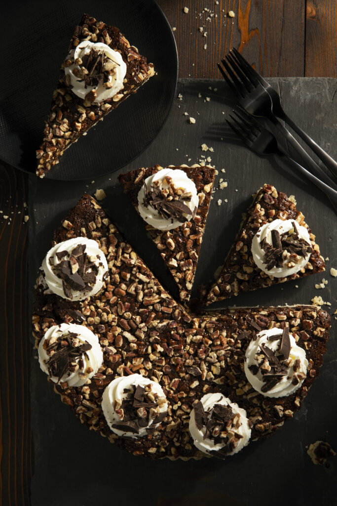 Chocolate Bourbon Pecan Pie: Decadent twist on a classic recipe, stealing the spotlight at every table.