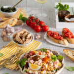 A table setting of Italian rice salad and Bruschetta