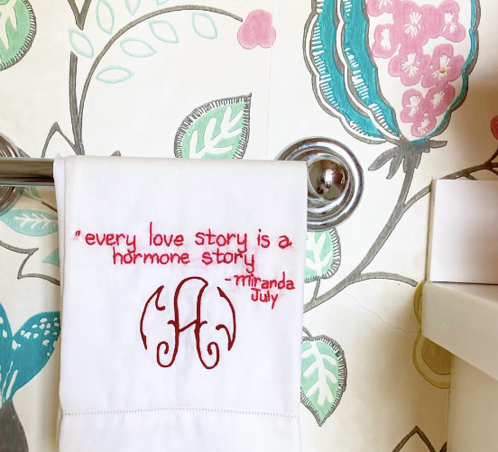 A piece of Diana Weymar's embroidery reading 'Every love story is a hormone story