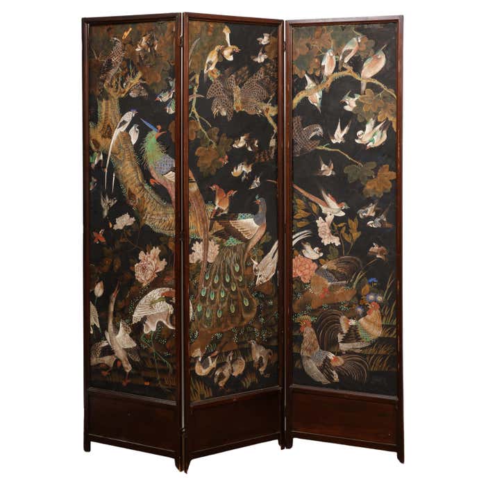 A folding screen door from 1stDibs and Nate Berkus' Pride Collection has Japanese painted birds across the front.