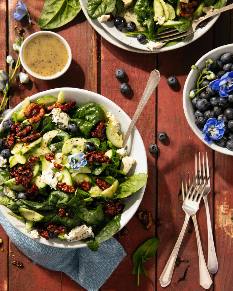 A fresh summer salad with blueberries and blue cheese.