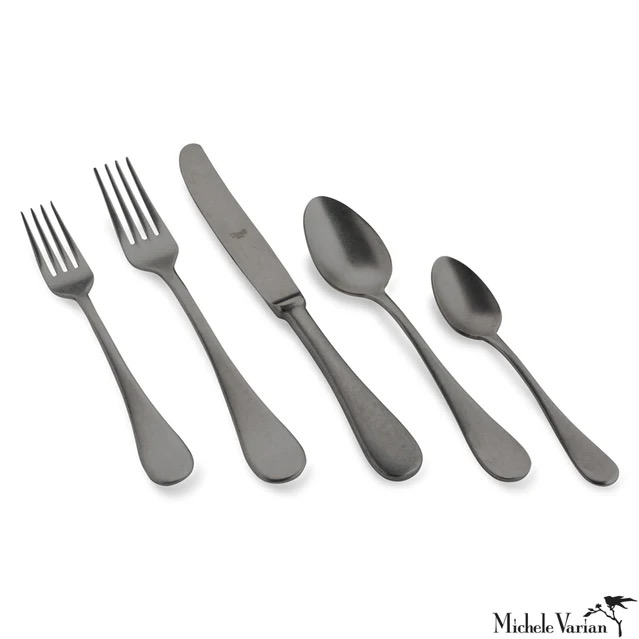 A set of two knives, a fork, and a spoon on a white background 