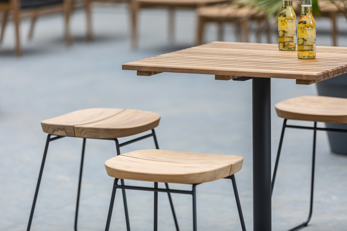 Nordic-inspired barstools on a table by Oasiq