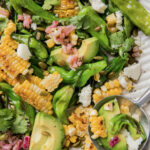 A shishito pepper corn salad in a bowl.