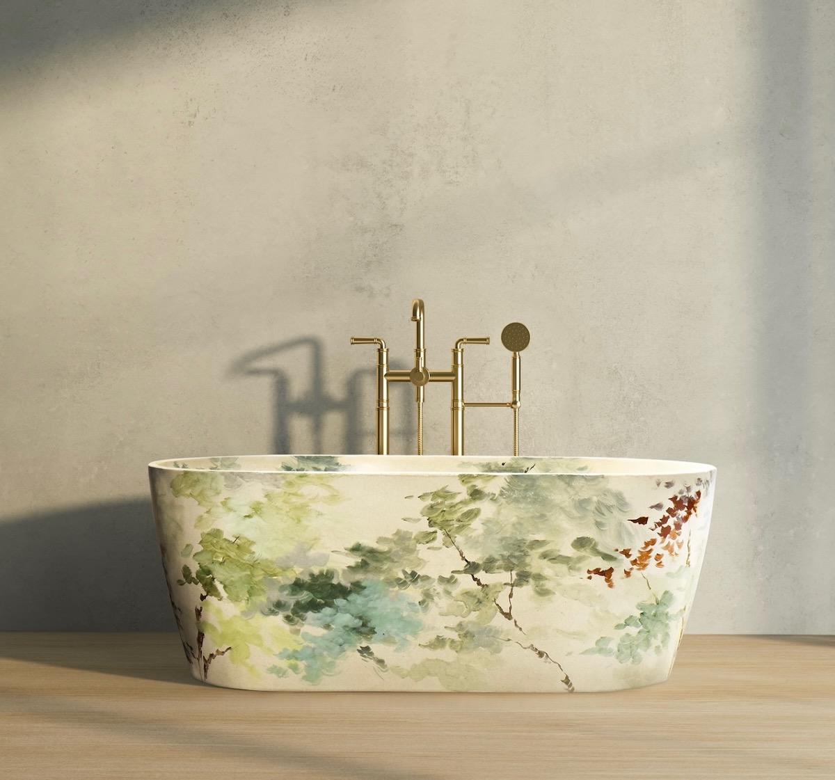 A bathtub with hand-painted florals from Konqrit sits against a blank wall.