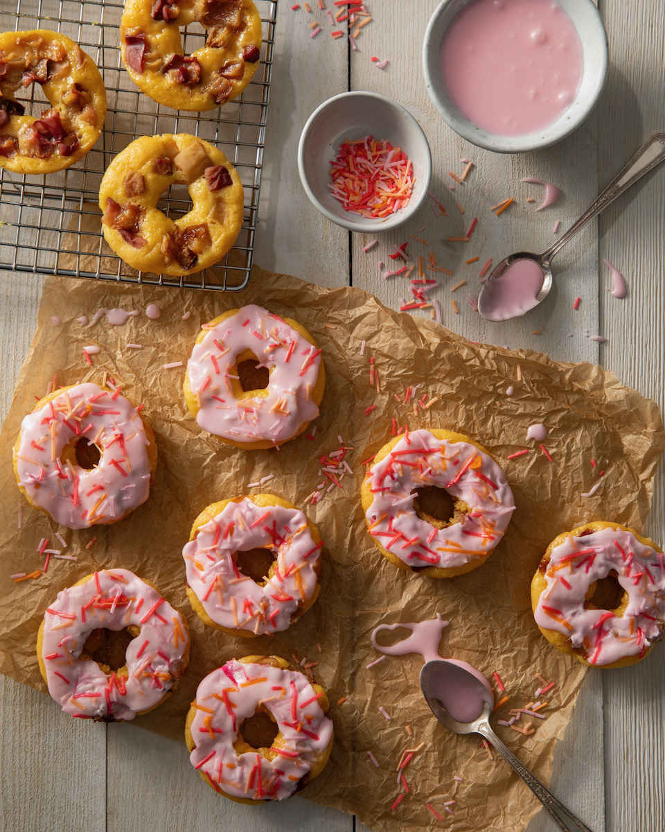 A set of peach donuts on a white background