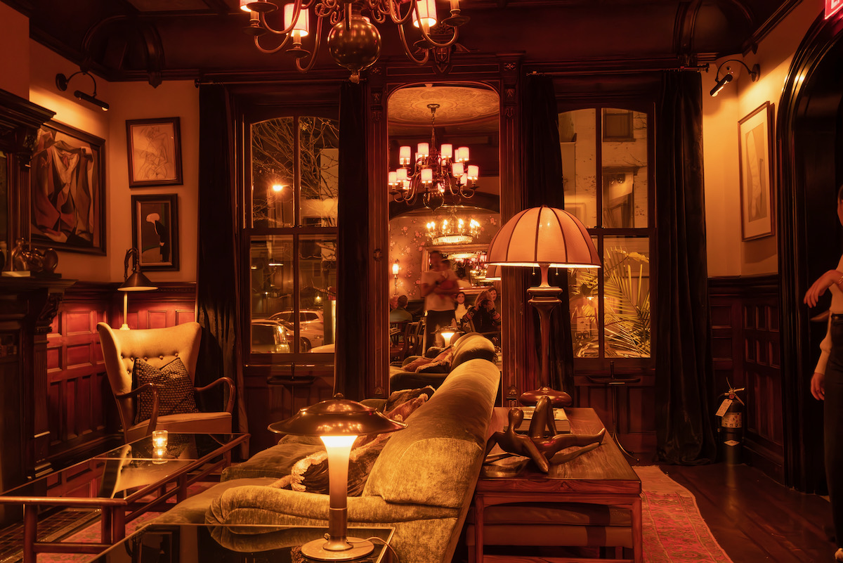 The interior of a restaurant in the Hudson Valley, lit in red