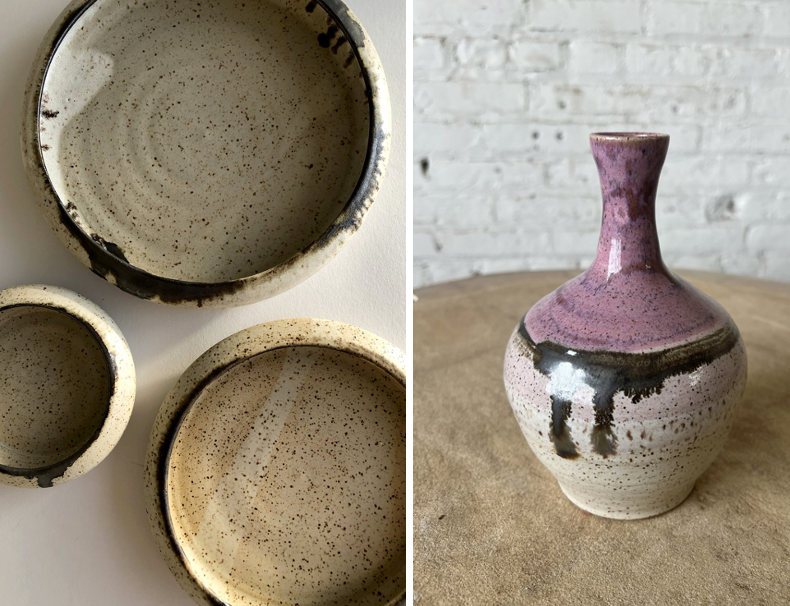 Three plates and a vase against a white brick backdrop