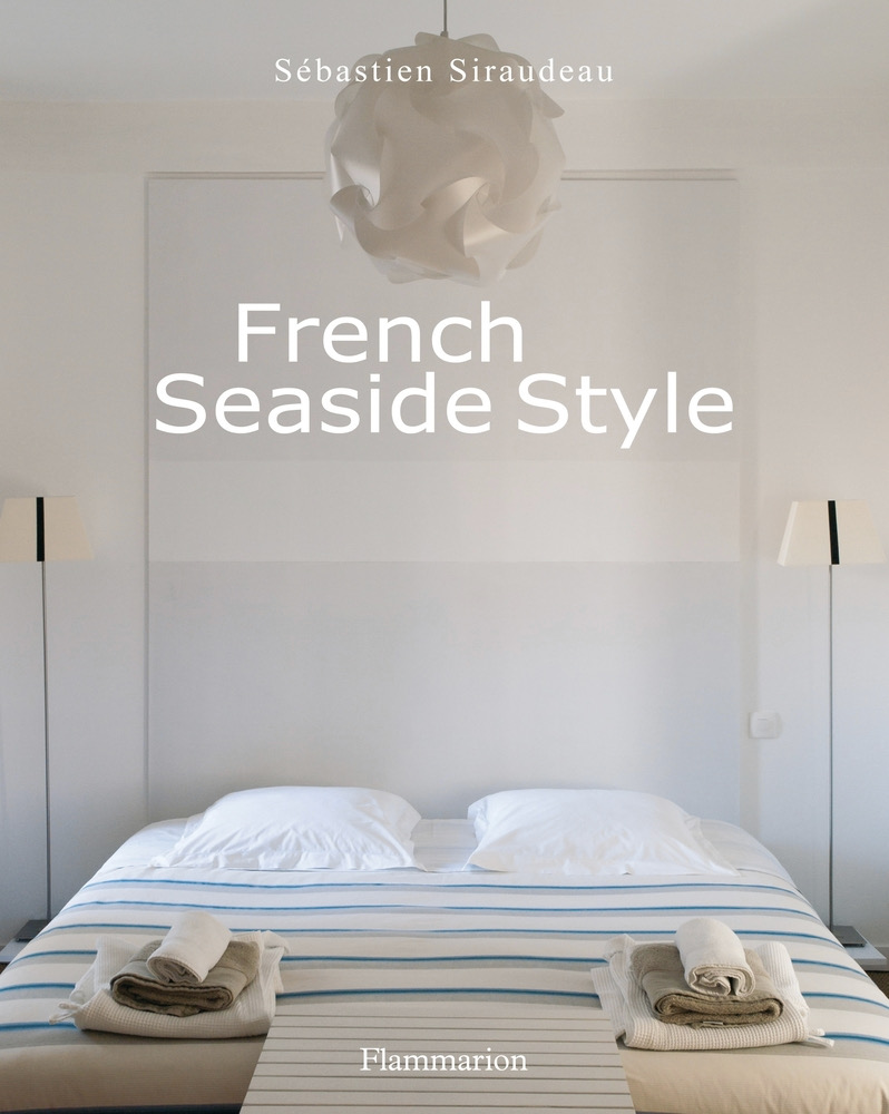 The cover of French Seaside Style, a white bed in a minimalist bedroom in the South of France