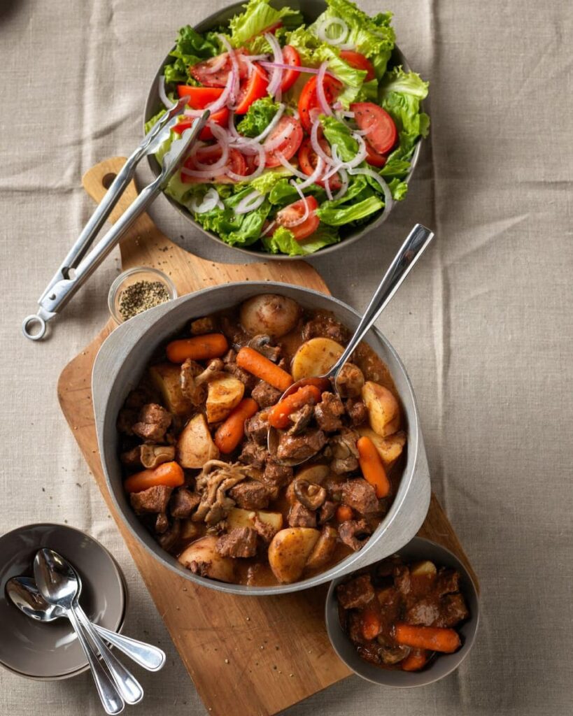 A hearty bowl of stew filled with tender beef and a medley of wild mushrooms.