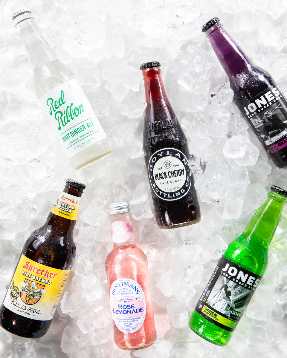 The bottles of frivolous soda.