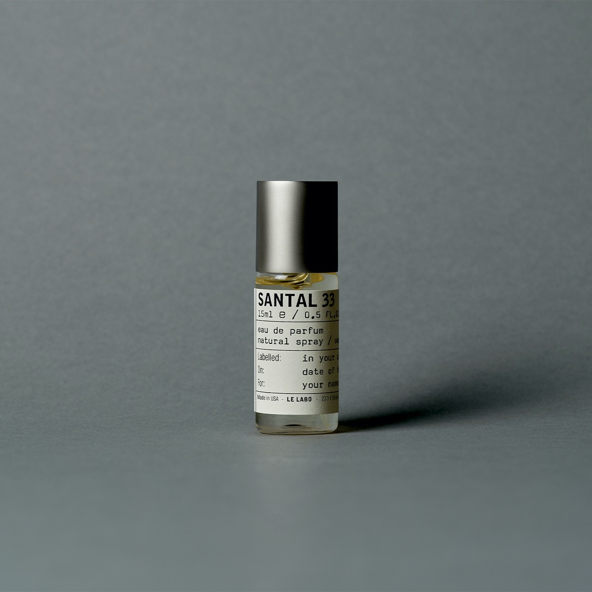 A small bottle of Santal 33 by Le Labo