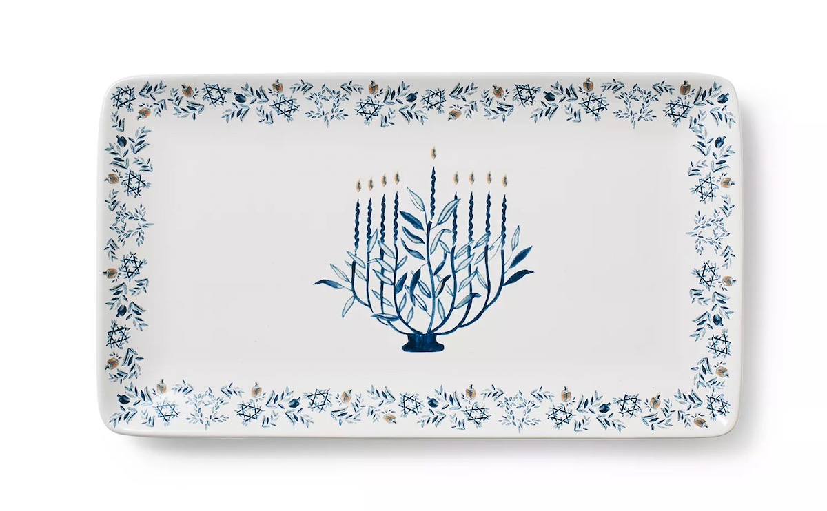 A serving tray for a Hanukkah dinner decorated with blue and white Judaica decor