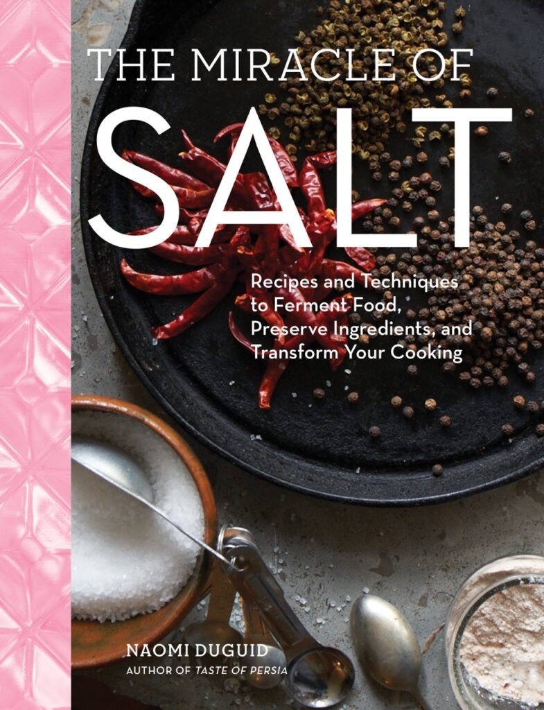 The cover of the book The Miracle of Salt with a pink strip down the left side and salt on a plate in the center.