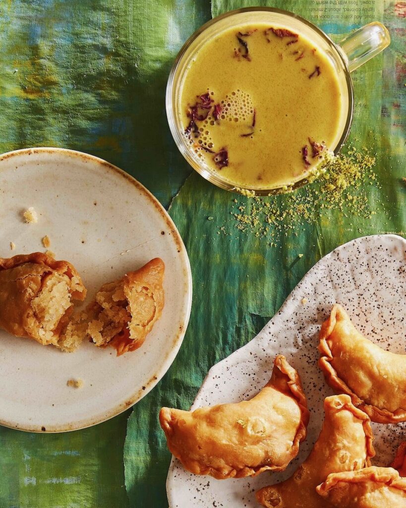 Thandai staged with gujiyas, a sweet Indian treat for Holi